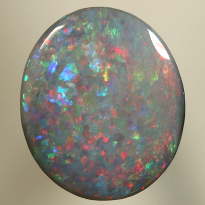 SOLID SEMI BLACK OPAL Sparkles of red over blue with a touch of green